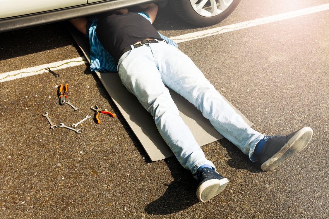 Man Lying Under a Car