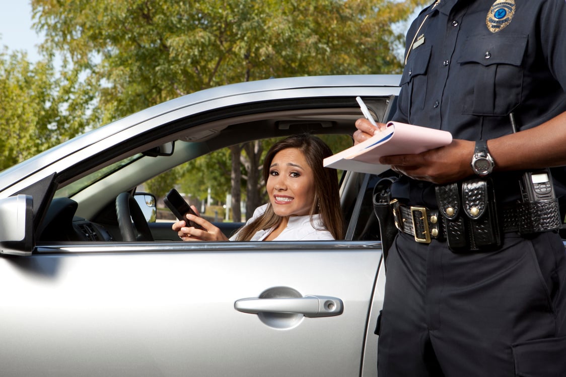 Police Officer writing a traffic ticket